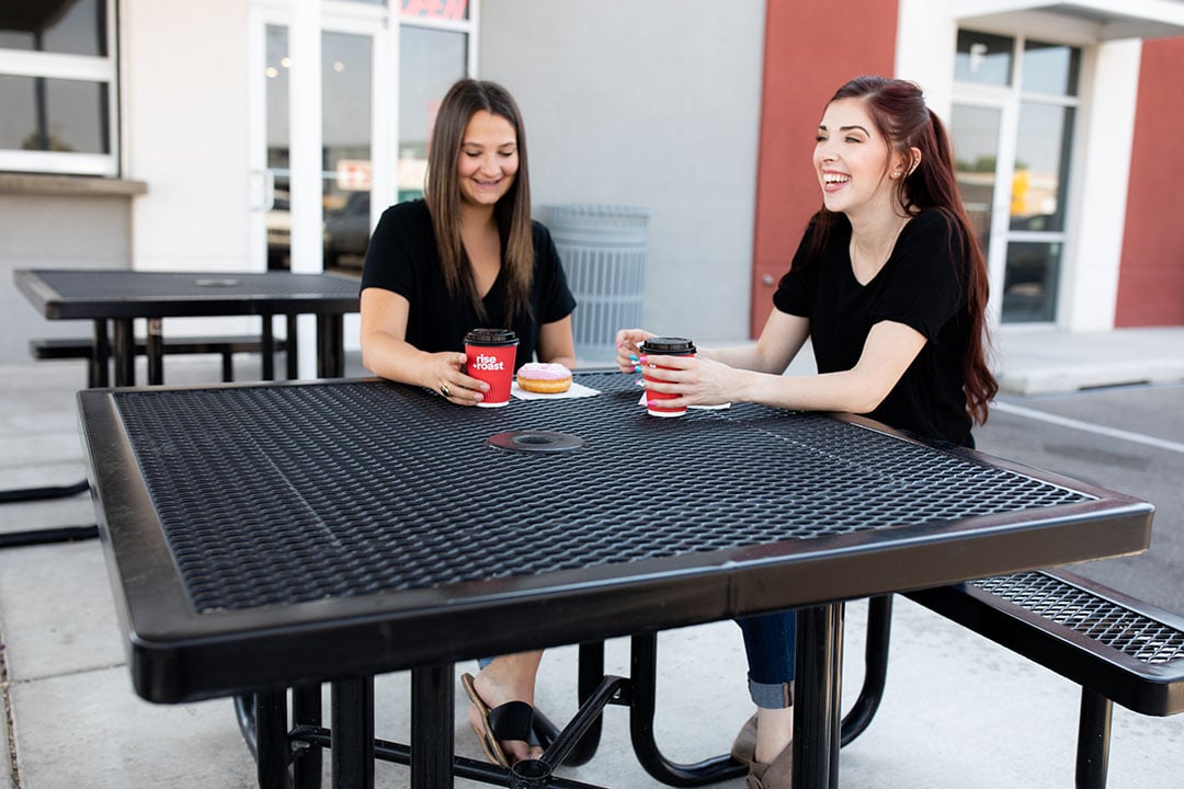 Two women drinking coffee at a Rise and Roast-Regal Square Portable Table-T46RC-View 04-Web